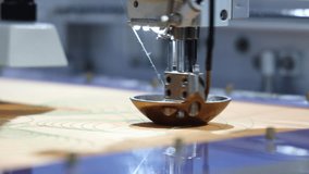 Sewing automate robot. Close up of industrial embroidery or sewing machine precisely stitching patterns onto fabric. Advanced automation in textile production and needlework with high technology. - Powered by Shutterstock - Get 15% off with code: PIKWIZARD15