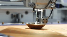 Sewing automate robot. Close up of industrial embroidery or sewing machine precisely stitching patterns onto fabric. Advanced automation in textile production and needlework with high technology. - Powered by Shutterstock - Get 15% off with code: PIKWIZARD15