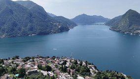 Blue water of Lake Lugano Switzerland high angle drone,aerial 4K footage - Powered by Shutterstock - Get 15% off with code: PIKWIZARD15