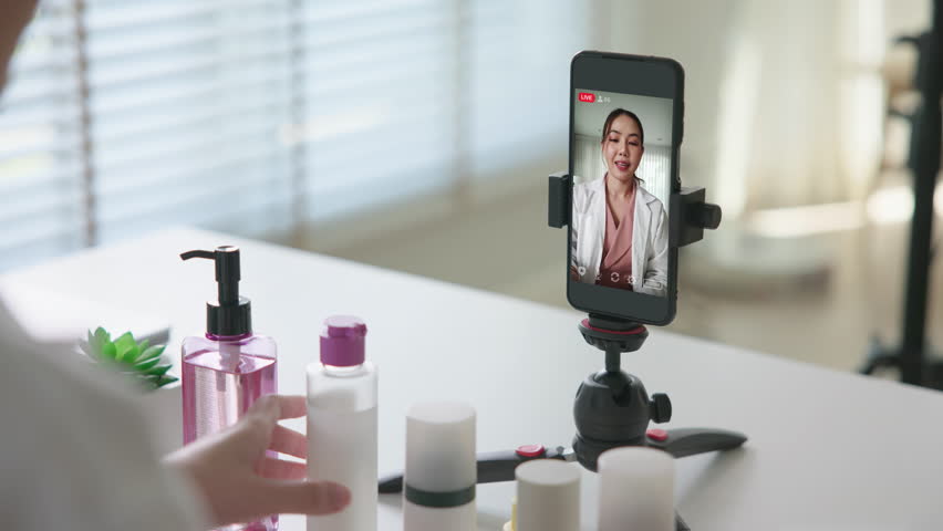 Asia woman people anti aging expert modern health vlogger live advice talk selfie video mobile phone camera. Online digital seller asian small SME store shop owner side hustle filming sell skin care.