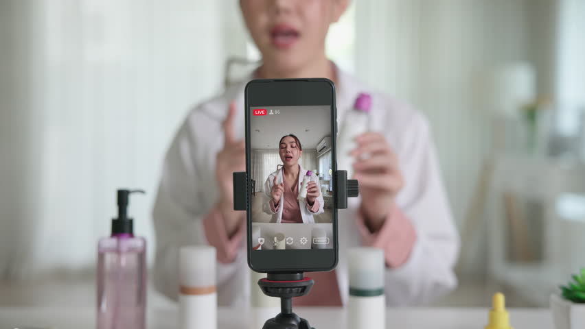 Asia woman people anti aging expert modern health vlogger live advice talk selfie video mobile phone camera. Online digital seller asian small SME store shop owner side hustle filming sell skin care.