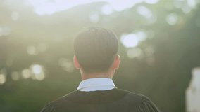 Rear view of graduate adjusting cap, graduation ceremony concept, academic achievement, higher education success, university celebration. - Powered by Shutterstock - Get 15% off with code: PIKWIZARD15