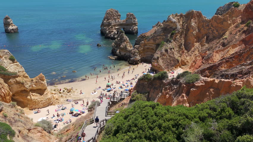 Aerial view of the famous Praia do Camilo beach during summer in Lagos, Algarve region, southern Portugal.