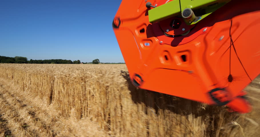 A combine harvester in the wheat fields, Allier department, France.