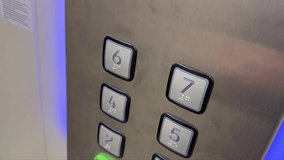 Hand pressing the button in modern lift or elevator - Powered by Shutterstock - Get 15% off with code: PIKWIZARD15