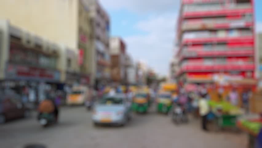Bokeh view of road traffic on the streets of Bangalore, India. Blurred background footage.