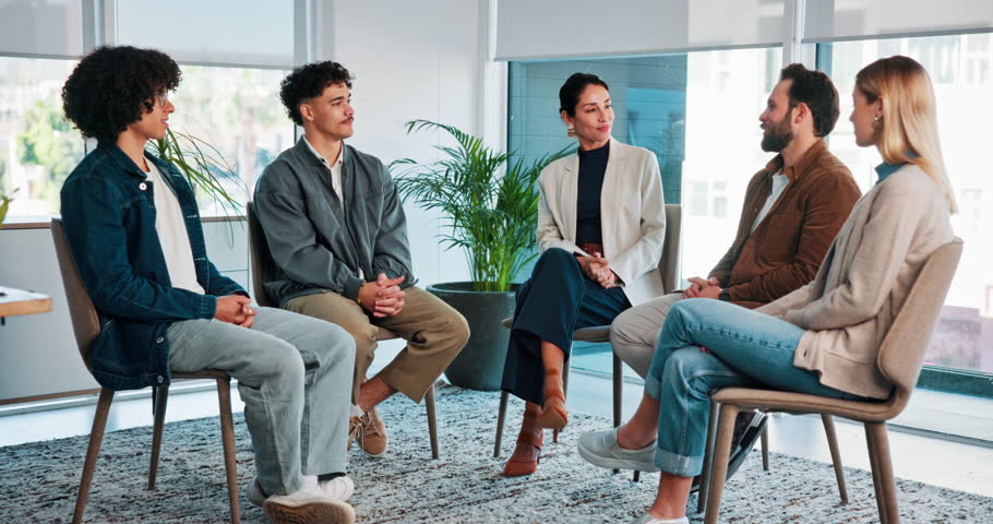 Accountability, group therapy and support with people in office together for advice, growth or healing. Counseling, meeting and workshop with man speaking to therapist in session for psychology