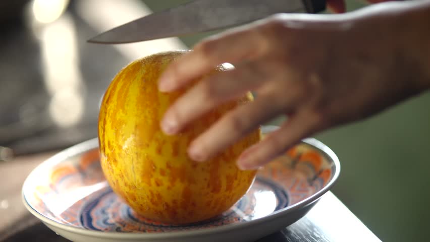Cutting Yellow Melon With Knife. Preparing Fresh Fruit Healthy Eating. Slicing Fruit Kitchen Task. Diet And Nutrition Organic Food. Food Preparation. Sweet Melon Tasty Fruits. Refreshing Fruit Snack