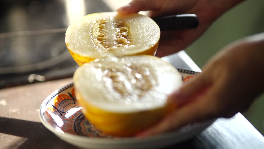 Cutting Yellow Melon With Knife. Preparing Fresh Fruit Healthy Eating. Slicing Fruit Kitchen Task. Diet And Nutrition Organic Food. Food Preparation. Sweet Melon Tasty Fruits. Refreshing Fruit Snack