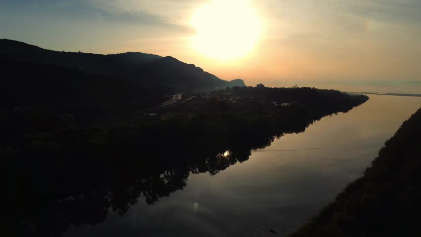 Aerial View of river, Beautiful Aerial View of African Jungles forest and River, Landscape in aerial drone shot. Adove calm tranquil river in Jijel Algeria North Africa, River and green fores trees