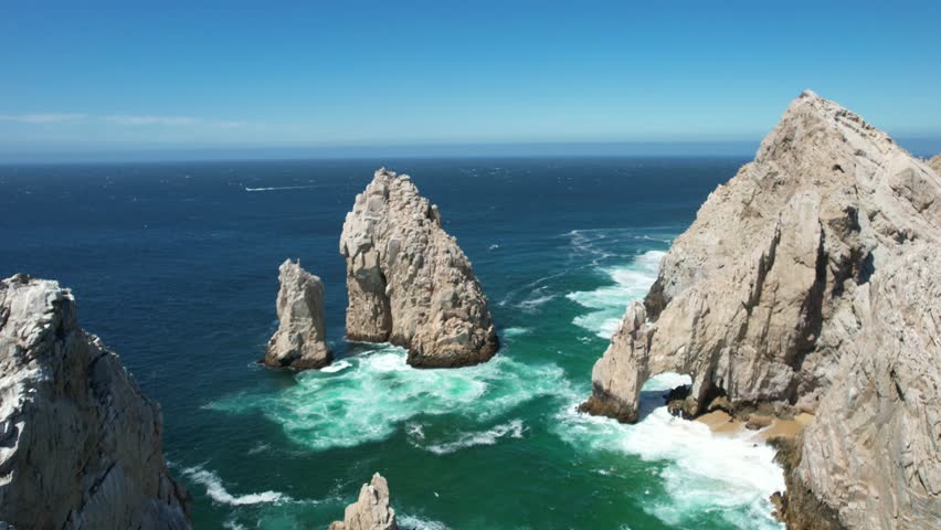Drone flight over the Arch of Cabo San Lucas, the tip of Baja California Sur, Mexico.