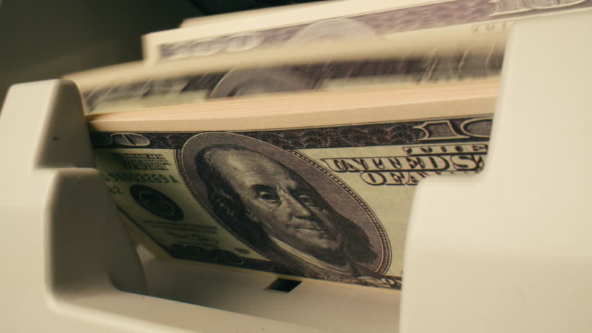 Banknotes and bag counter, Specialised police officer Counting dollar euro banknotes in crime lab with machine, cashed out criminal money, bitcoin changing, buying home flat in bank. 