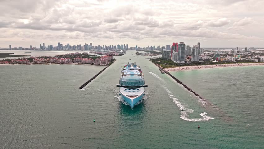 Cruise ship tour and travel at sea. Aerial view of luxury liner voyage. Ship leaving Miami beach port. Miami tour. Cruise ship voyage. Aerial view of cruise in summer vacation. Go on a voyage