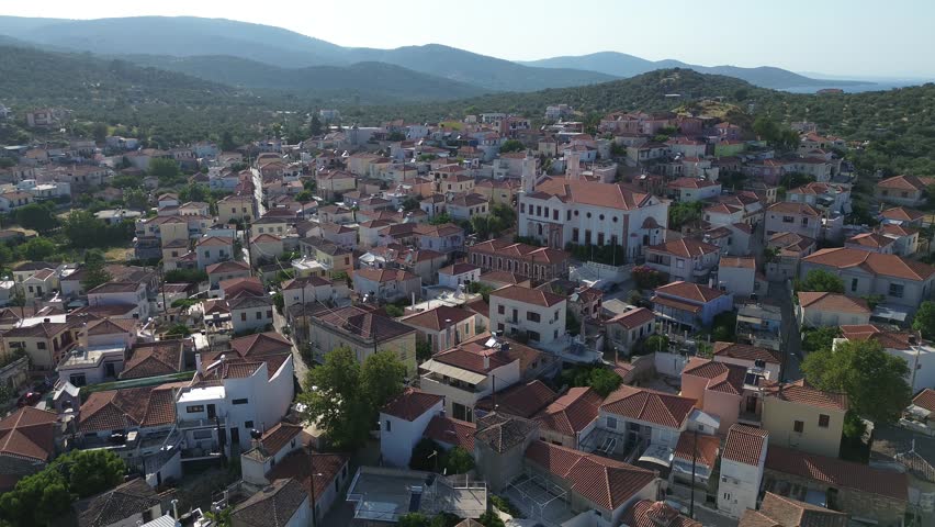 Pamfila, Island Lesvos, Greece - July 15th, 2025 - footage of the land-locked village and seaside part, mountains, landscapes, blue Aegean Sea, churches and traditional architecture 