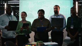 Portrait of employees team preparing a pitch for investors group meeting, working on ways to obtain more funds. Professional diverse colleagues address financial status after hours. Camera A. - Powered by Shutterstock - Get 15% off with code: PIKWIZARD15