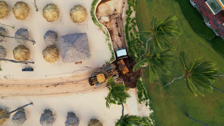 Tractor Loading Sargassum Seaweed into Truck at Resort Beach Cleanup