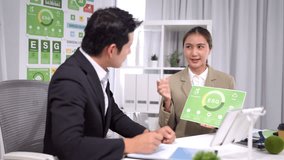 Business people analyze net zero environmental report at office meeting discussing sustainable corporate strategy green investment future - Powered by Shutterstock - Get 15% off with code: PIKWIZARD15