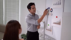 Asian businesswoman checking phone in office. Focused adult female using mobile device. Digital communication productivity. - Powered by Shutterstock - Get 15% off with code: PIKWIZARD15