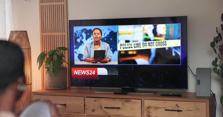 Screen, person and watching tv with breaking news, broadcast and increase in gender based violence. Television display, home and woman listen to info for crime rate, headline and report in lounge