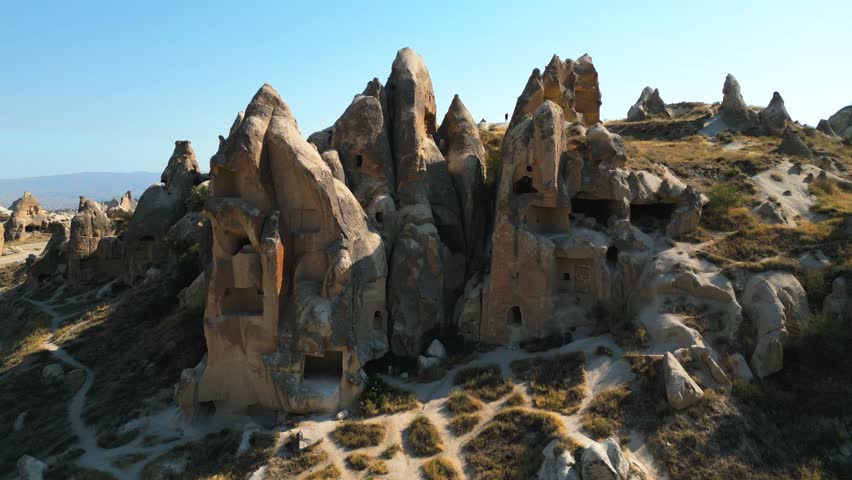 4K Stunning aerial footage of Göreme, a historic town nestled among Cappadocia’s iconic fairy chimneys. This drone video showcases the traditional stone houses. Cappadocia - Turkey_21