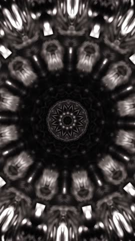 Black and white photo of circular object with circular design. Kaleidoscope VJ loop.
