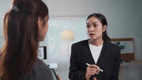 Businesswoman explaining data analysis to a colleague using a digital tablet in a modern office setting - Powered by Shutterstock - Get 15% off with code: PIKWIZARD15