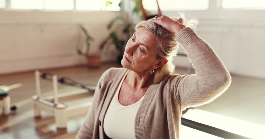 Stretching, fitness and senior woman in studio, exercise and wellness with retirement. Pensioner, peaceful and mature person with progress, balance and pilates with workout, challenge and breathing