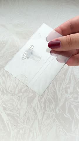 Women's hands put paper in a badge. A badge for a student, a consultant in a store.