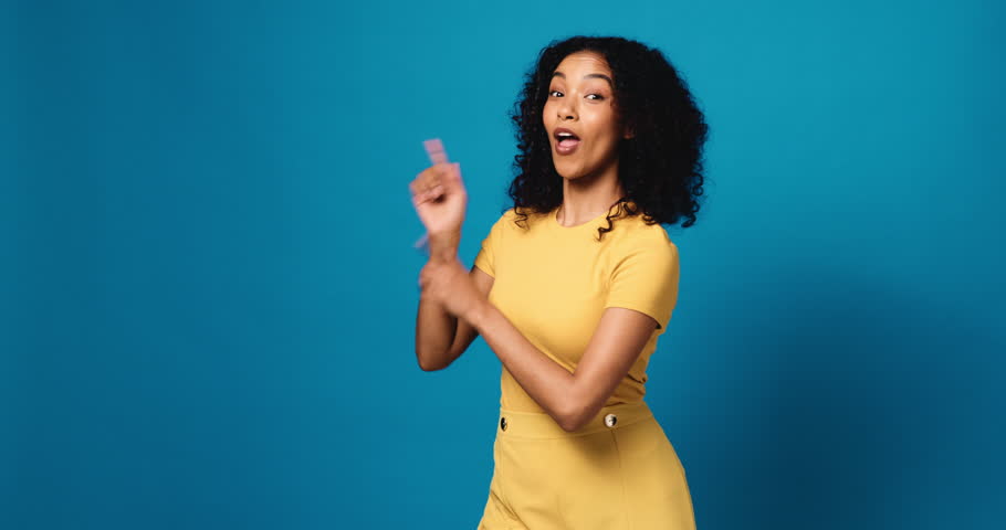 Studio, face and woman with presentation, pointing and smile for discount offer, mockup space or ad. Blue background, happy and person with gesture for announcement, suggestion or excited with news
