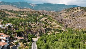 A traditional village mosque stands tall among red-roofed houses. countryside scene. rural houses. - Powered by Shutterstock - Get 15% off with code: PIKWIZARD15