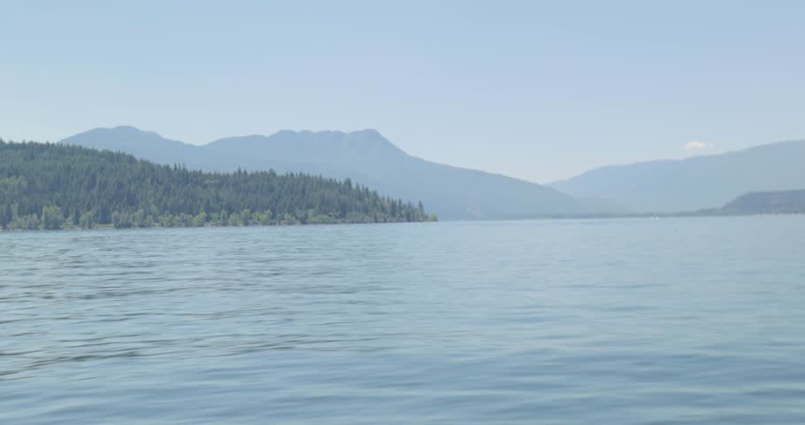 Boating on the beautiful scenic waters of lake Shuswap near Salmon Arm British Columbia, Canada.