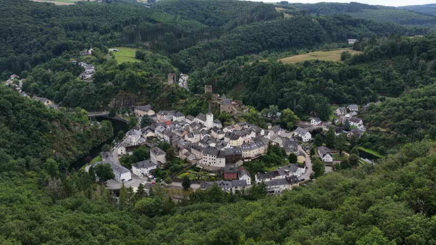Chateau de Esch sur Sure, castle, small historic village in the Luxembourg. Green landscape. Aerial video.