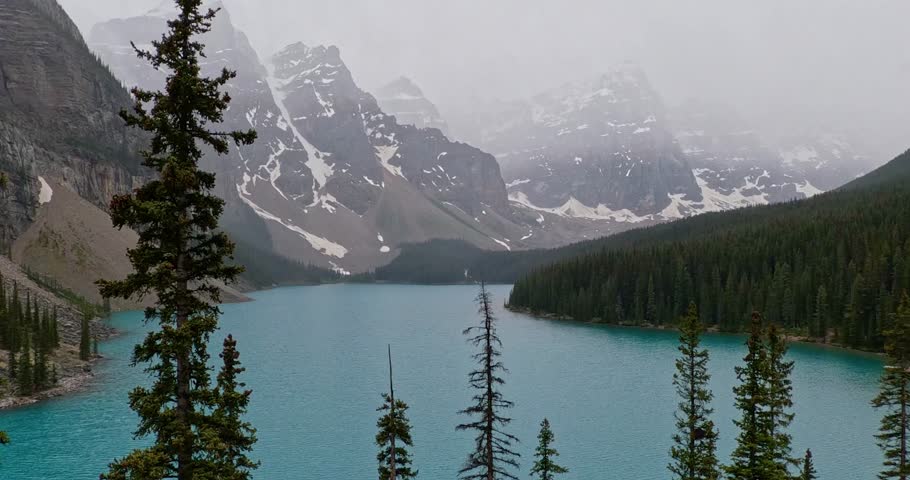 View overlooking the beautiful azure blue waters of Moriane Lake in Banff National Park in Alberta Canada.