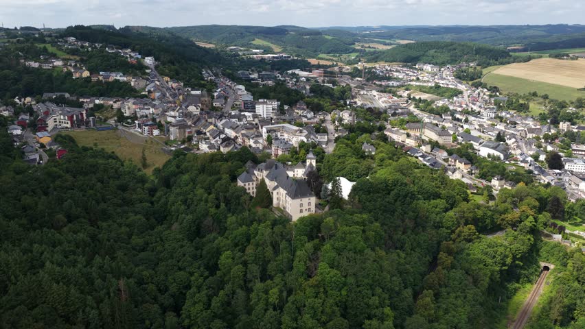 Aerial video of Wiltz Castle, Chateau de Wiltz, Schloss Wiltz, Schlass Wolz, located in Wiltz in the north of Luxembourg, dates back to 1573.