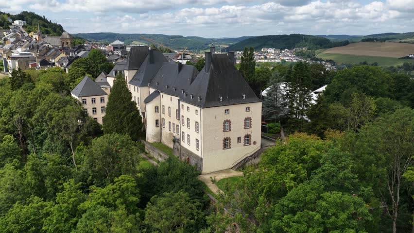 Aerial video of Wiltz Castle, Chateau de Wiltz, Schloss Wiltz, Schlass Wolz, located in Wiltz in the north of Luxembourg, dates back to 1573.