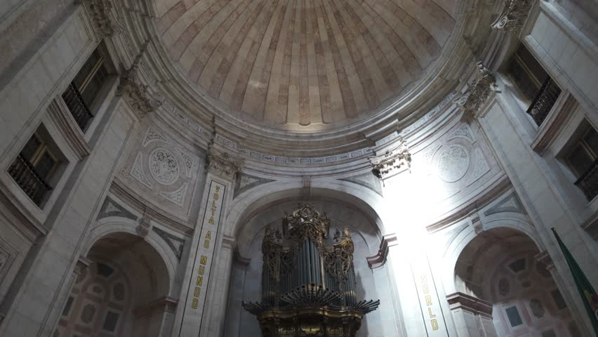 Majestic pipe organ takes center stage within the grand interior of the National Pantheon, Lisbon, Portugal, showcasing intricate details and historical significance