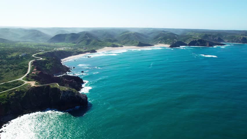 Scenic View Blue Sea And Green Mountain Range. - aerial shot