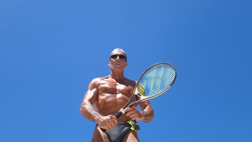 A man practicing tennis outdoors - Powered by Shutterstock - Get 15% off with code: PIKWIZARD15