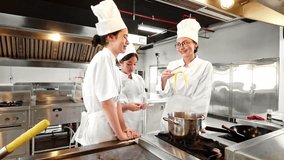 Professional cooking class in session at a chef training institute. Female instructor teaches two students in a modern commercial kitchen, highlighting culinary skills, teamwork, and hands-on learning - Powered by Shutterstock - Get 15% off with code: PIKWIZARD15