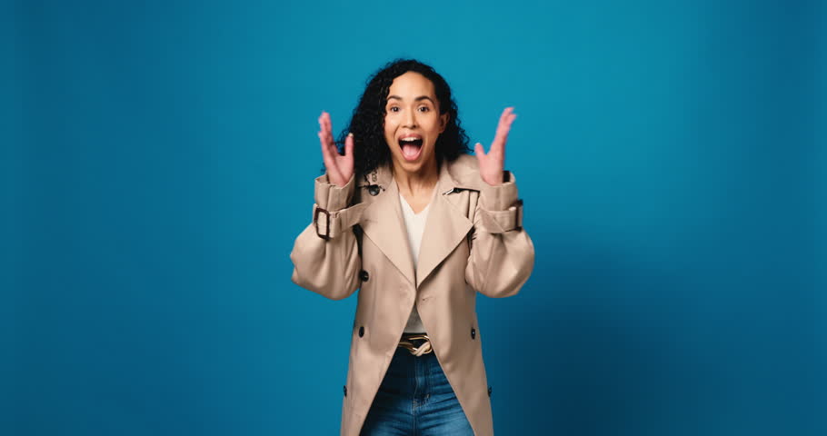 Face, surprise and woman in studio, smile and announcement on blue background. Portrait, space and person with happiness, shock or good news with wow, winner or deal with success or facial expression