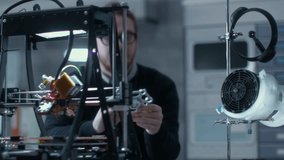 Engineer Assembles and Inspects a Mechanical Component at a Laboratory Workstation, Using Tools and Electronic Equipment. Focusing on Research and Development Tasks in a Modern Engineering Facility. - Powered by Shutterstock - Get 15% off with code: PIKWIZARD15