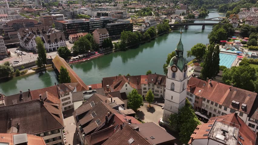 Aerial view of Olten, Switzerland, featuring the clock tower, covered bridge, and river Aare.