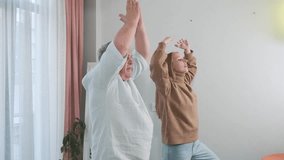 Adult daughter teaching her elderly father balancing on one leg in a yoga pose. Senior fitness, balance training, family exercise, intergenerational wellness, importance of movement for healthy aging - Powered by Shutterstock - Get 15% off with code: PIKWIZARD15