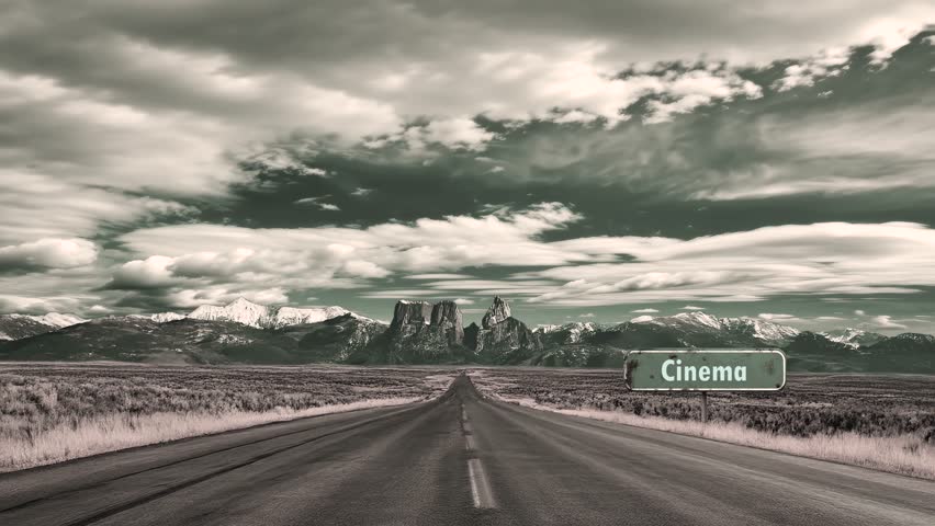 Video depicting a signpost pointing in the direction to Cinema