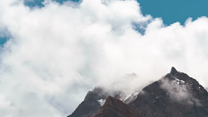 4K Timelapse of dark rain clouds over mountains in Meling at Lahaul, Himachal Pradesh, India. Clouds and mountain timelapse. Monsoon in mountains. Heavy rain, storm, cloudburst concept.