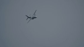 Twin engine aircraft banking in clear blue sky with propellers spinning - Powered by Shutterstock - Get 15% off with code: PIKWIZARD15