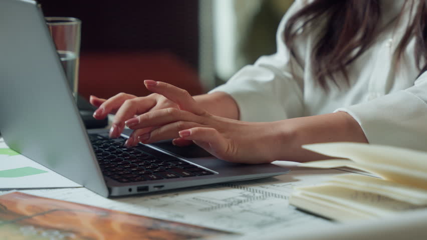 Asian woman female businesswoman business trader working online in office typing laptop girl Chinese Korean Japanese smiling employer manager executive worker programmer computer studying e-commerce