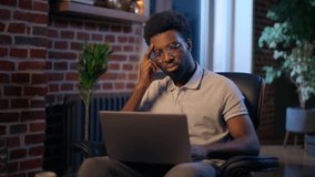 Thoughtful businessman African American guy thinking business man searching idea in evening office consider decision male trader employee think project plan online late working laptop in dark night - Powered by Shutterstock - Get 15% off with code: PIKWIZARD15