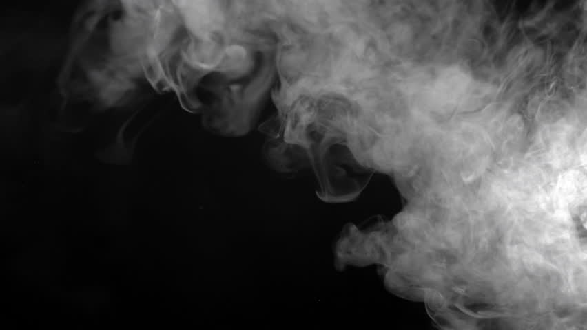 Swirling white smoke expands to fill the black frame. Hypnotic, smooth motion ideal for dramatic or mysterious scenes.