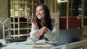 Asian businesswoman record audio message mobile phone send voice mail in office business woman friendly talking mic smartphone smiling Korean Japanese Chinese girl designer architect talk speakerphone - Powered by Shutterstock - Get 15% off with code: PIKWIZARD15